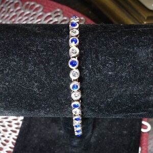 Bracelet, silver with Bezel set Blue and Clear Rhinestones, 8" long.